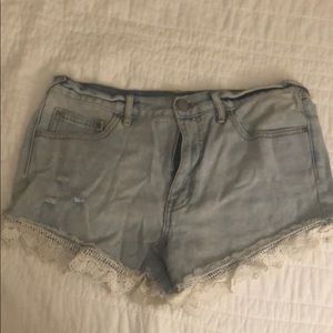 Free people denim shorts with lace detailing